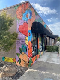 a colorful mural painted on the side of a building