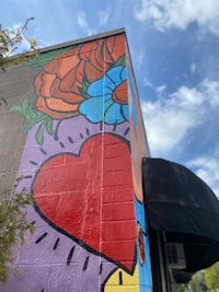 a colorful mural painted on the side of a building